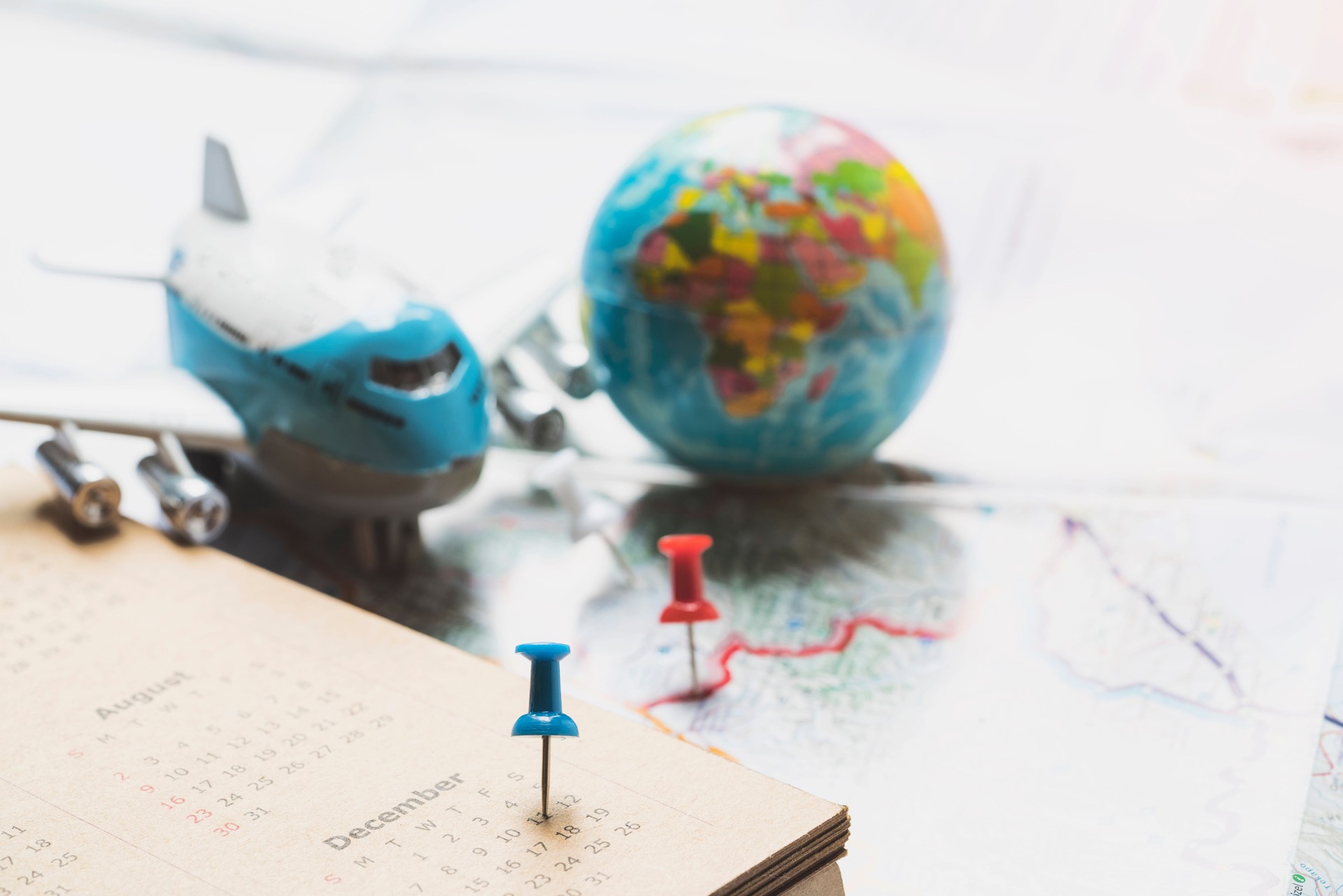 concept of travel vacation trip and long weekend planning on map and calendar background
